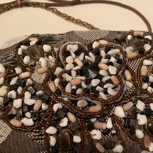 The cutest little brown encrusted with stones and beads bag